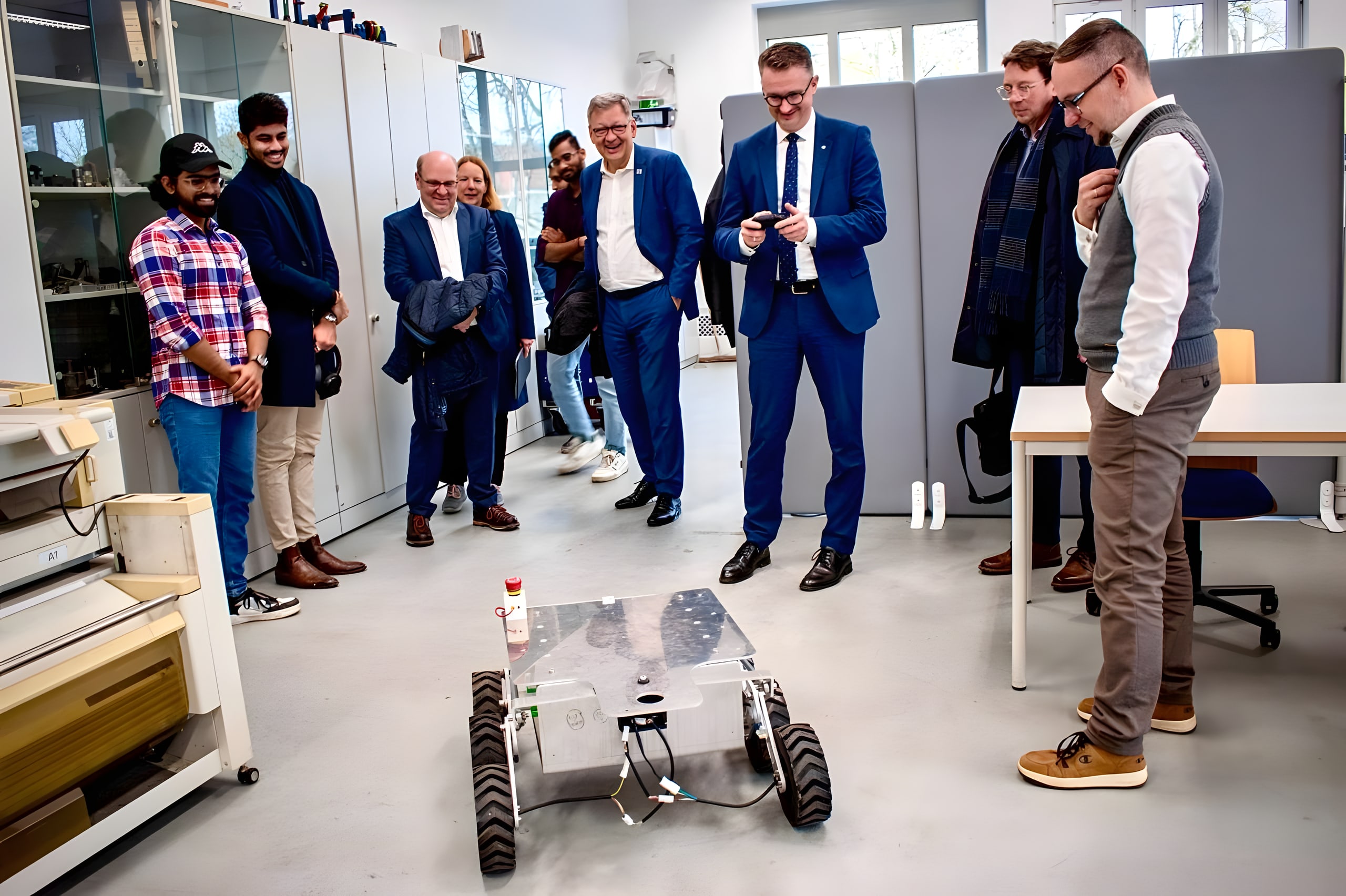 Thuringia's Minister of Science examines LEAP-One during a visit to the lab.