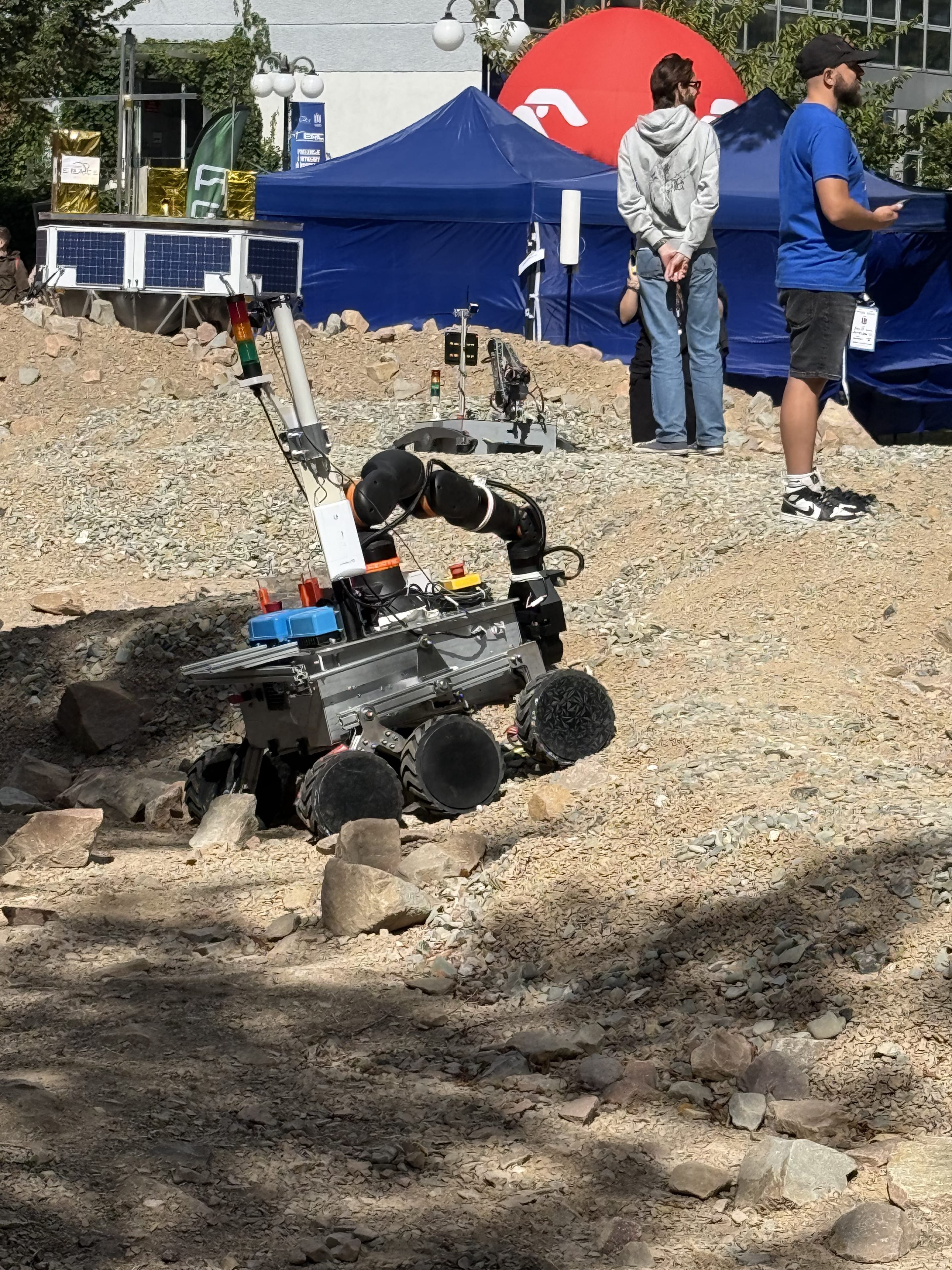 LEAP-One climbs the rocky slope with its suspension articulating over the stones.