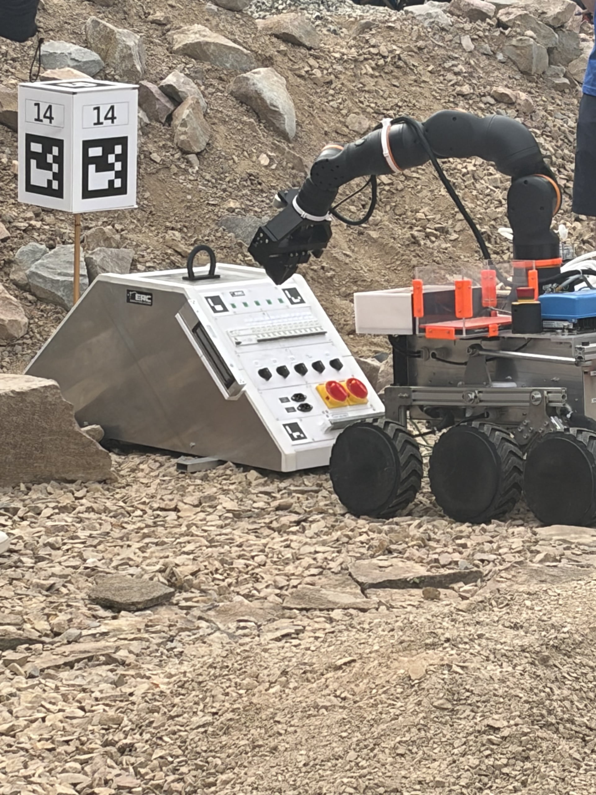LEAP-One reaches its arm toward the ERC maintenance panel beside marker 14.
