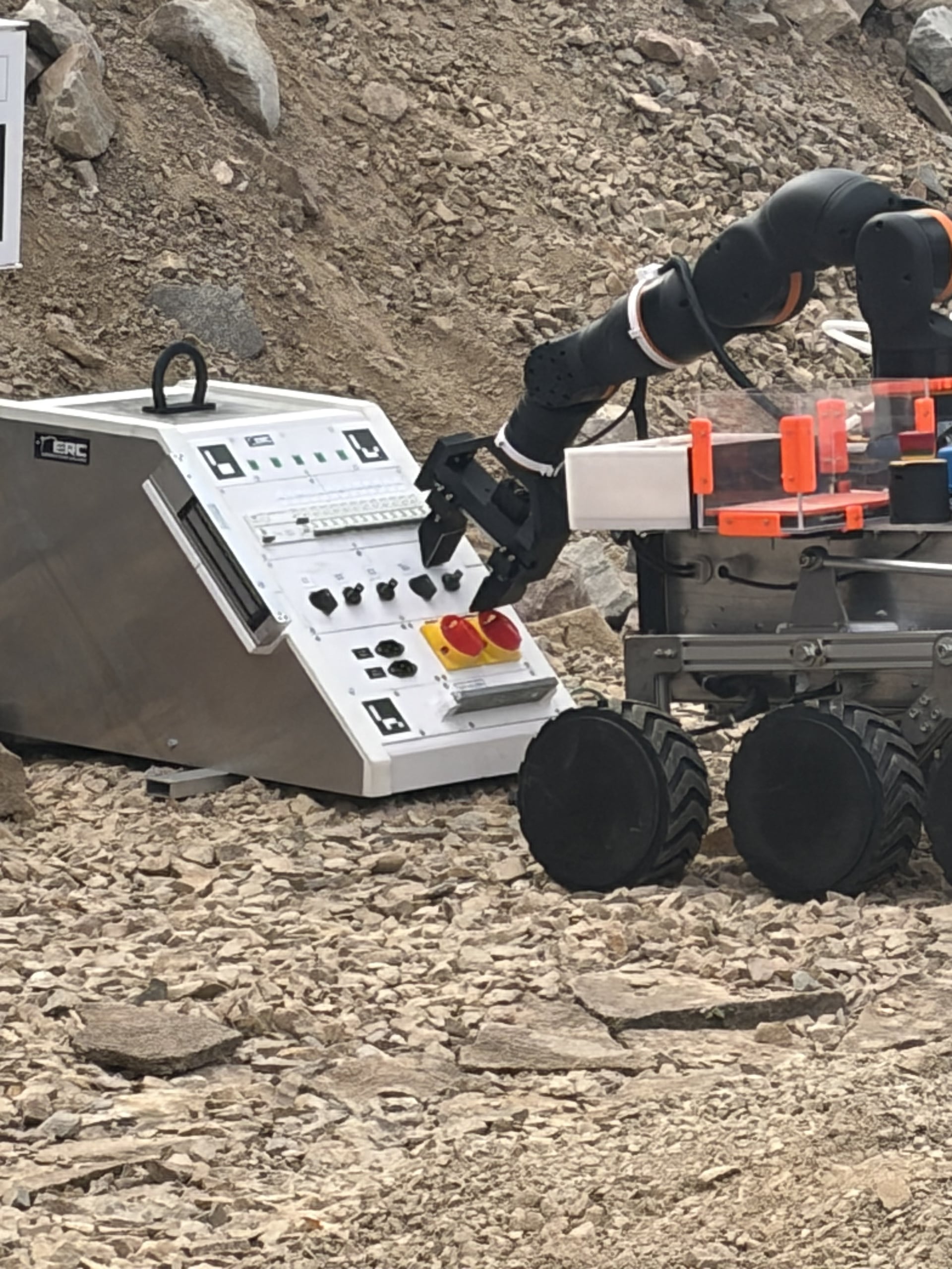 The gripper operates the switches on the maintenance panel.