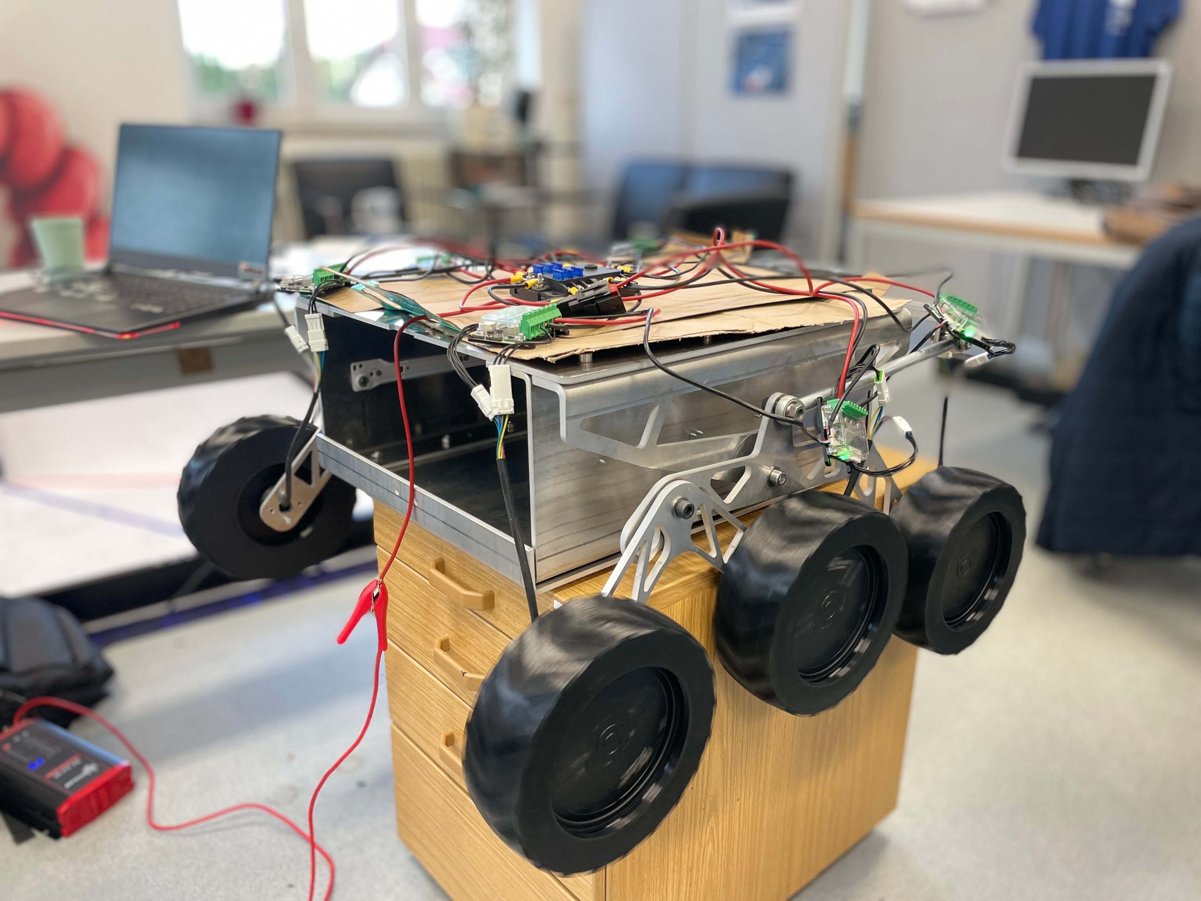 LEAP-One's bare chassis on a workshop pedestal during CAN-bus testing, ODrive controllers wired in.