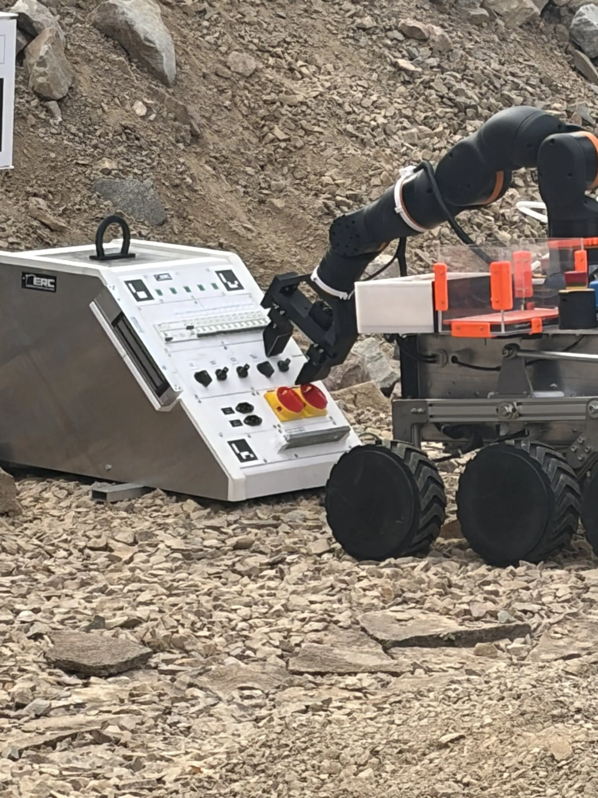 The gripper operates the switches on the maintenance panel.
