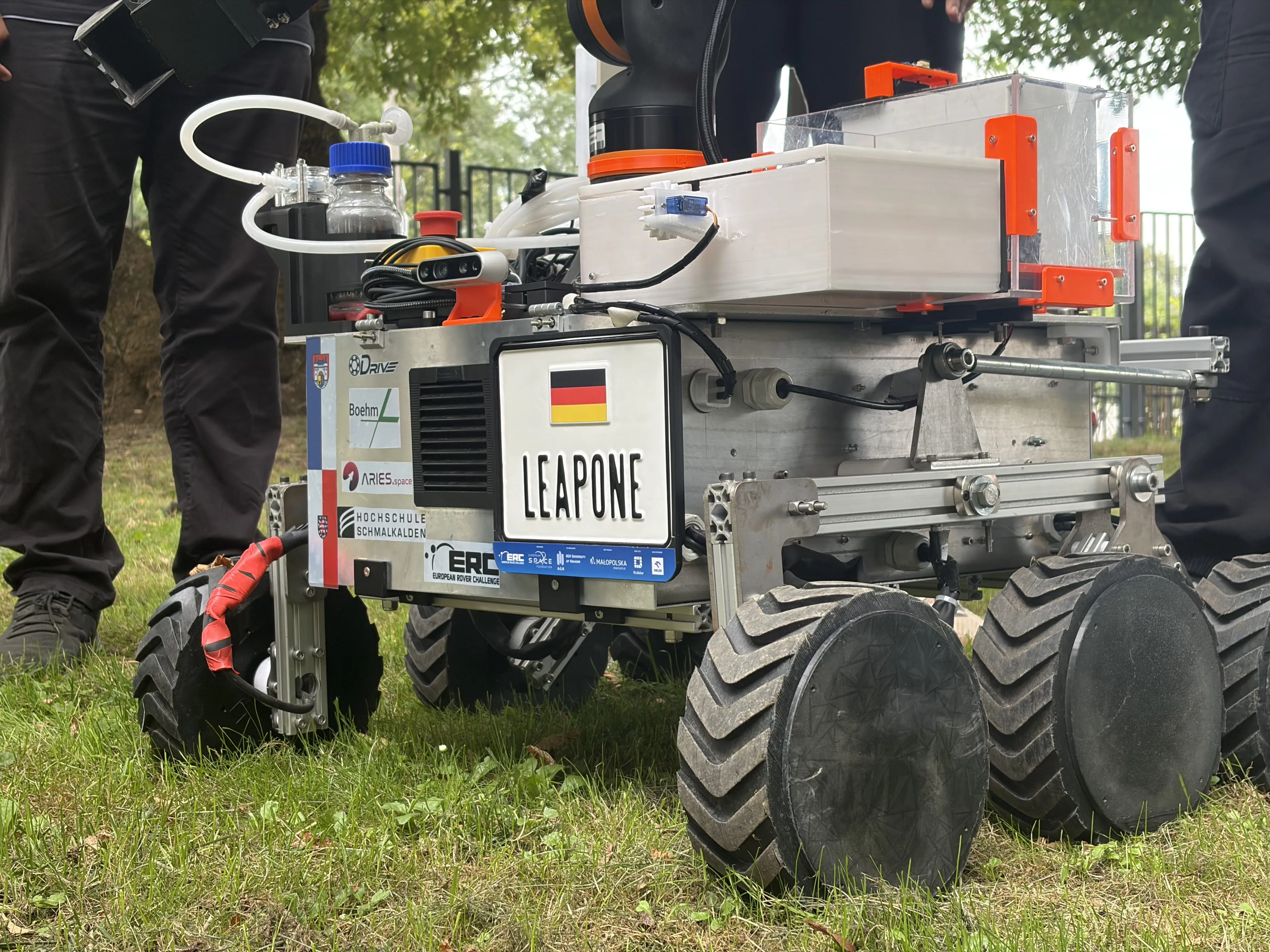 LEAP-One on the grass at ERC 2026 in Kraków, sponsor decals on the chassis side panel