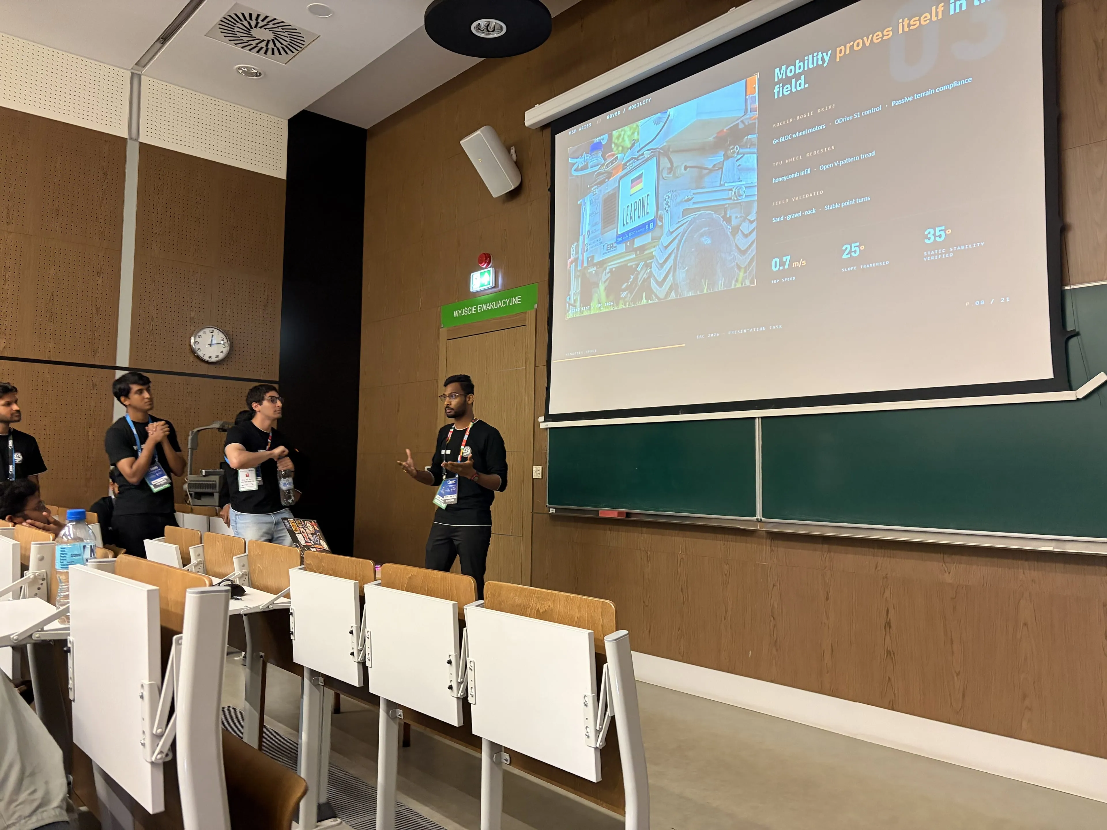 A team member presents LEAP-One's mobility results during the team presentation in the lecture hall.