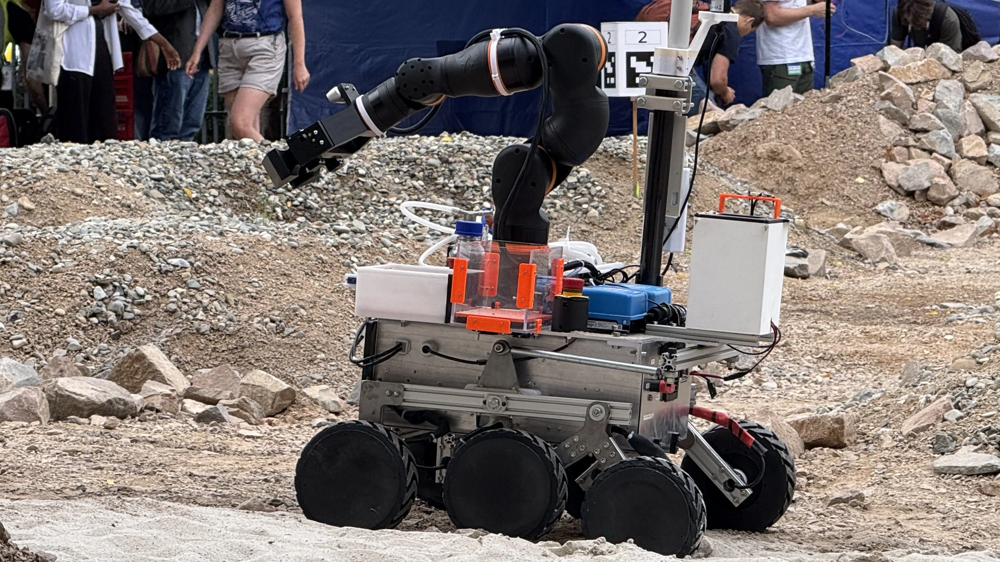 LEAP-One on the rocky ERC Mars yard with its robotic arm extended